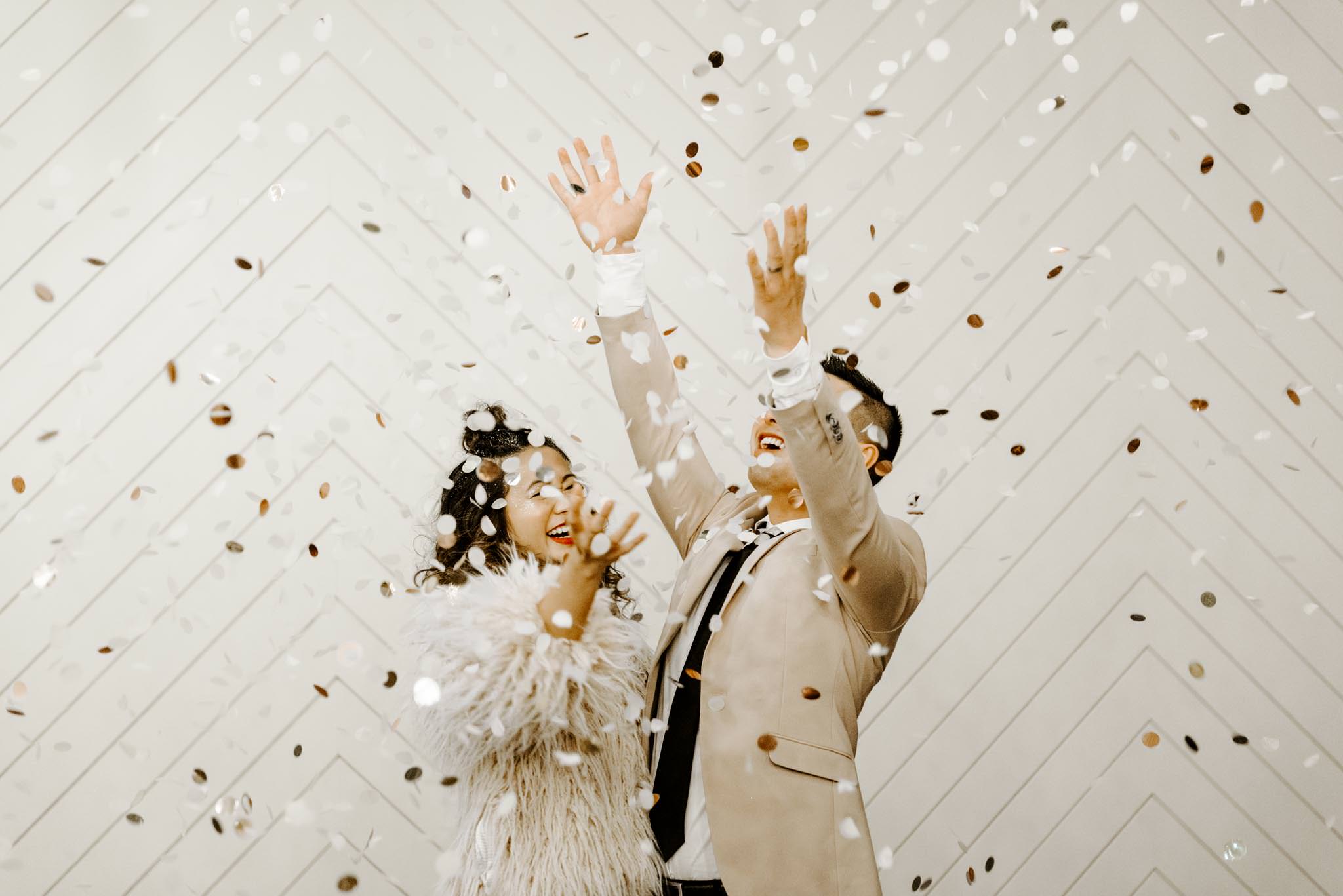 Oregon's best wedding celebration photography confetti throwing grand exit image of bride and groom