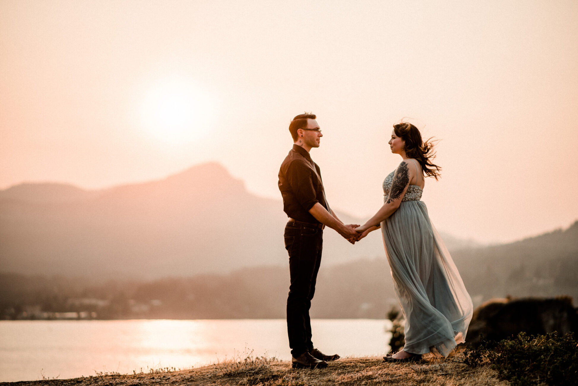 Columbia River Gorge Oregon Engagement session photo taken during sunset golden hour with black and grey long dress pic